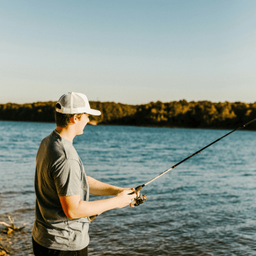 Young man fishing by the riverside near Milford PA