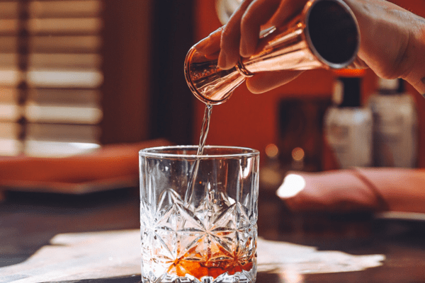 Image of bar jigger and margarita glass