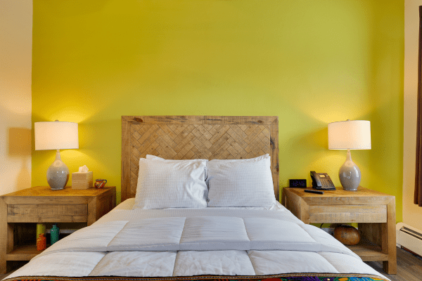 Bright bedroom interior in Deluxe Queen Room at La Posada Milford hotel