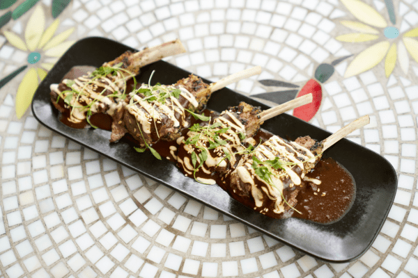 Close-up of Cochinita Pibil, traditional Mexican pork dish at Felix’s Cantina Milford