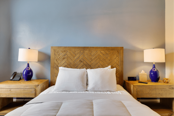 Queen bed with natural light in Deluxe Queen Room at La Posada Milford hotel